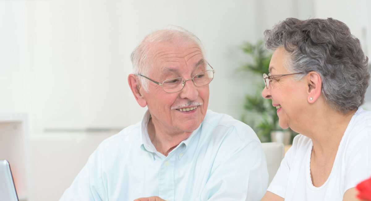 doctor with clipboard and senior woman at hospital