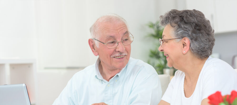 doctor with clipboard and senior woman at hospital